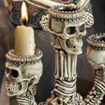 Cast resin Skulls on bones triple candle holder 6241
